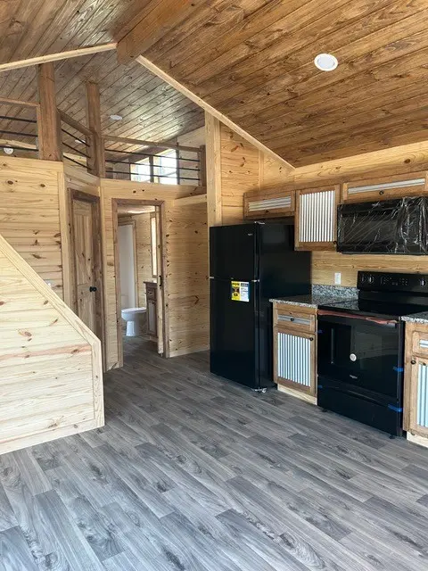 Kitchen and stairs to the loft in a pine interior